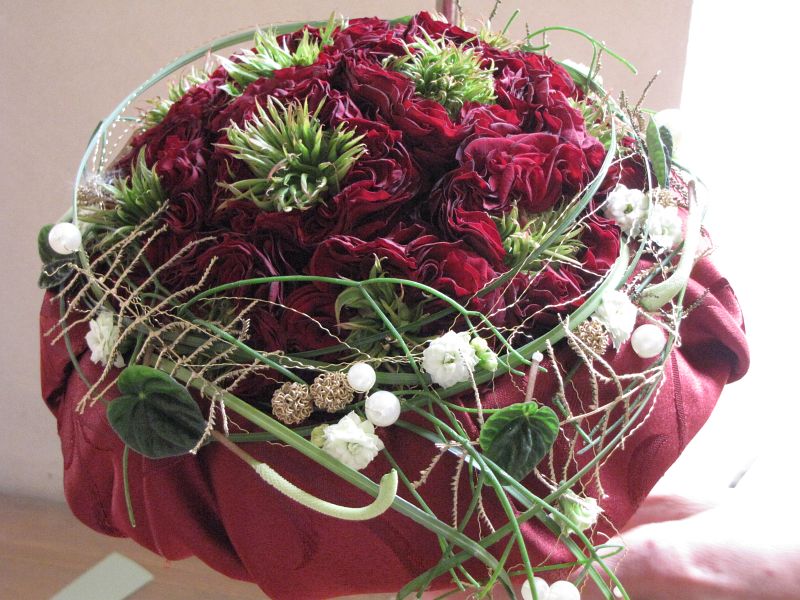 Round wedding bouquet for a bride at the rubious wedding